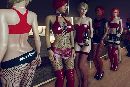 Perverse sex party with latex uniforms and foot fetish